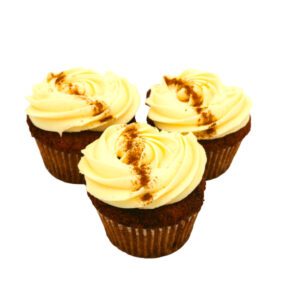 These moist carrot cupcakes are topped with a generous swirl of cream cheese frosting, delicately spiced with cinnamon.